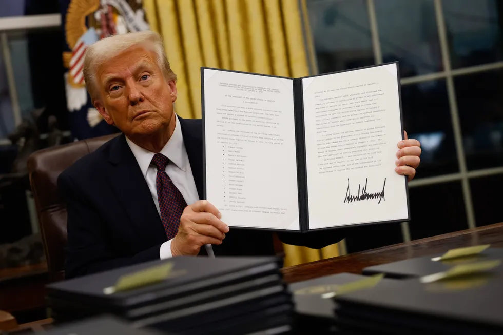 President Donald Trump signs executive orders in the Oval Office on January 20, 2025 in Washington, DC.