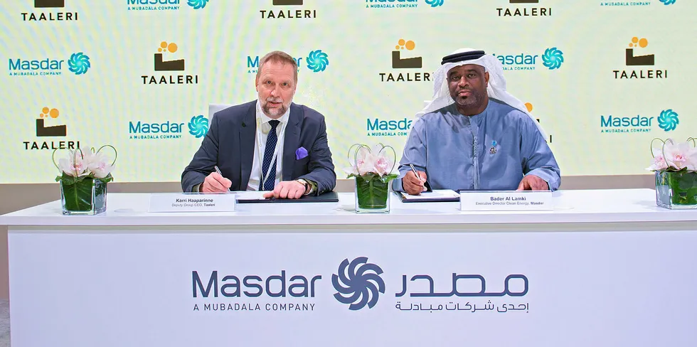 Masdar's Bader Al Lamki (right) signing an agreement with Taaleri Energia.