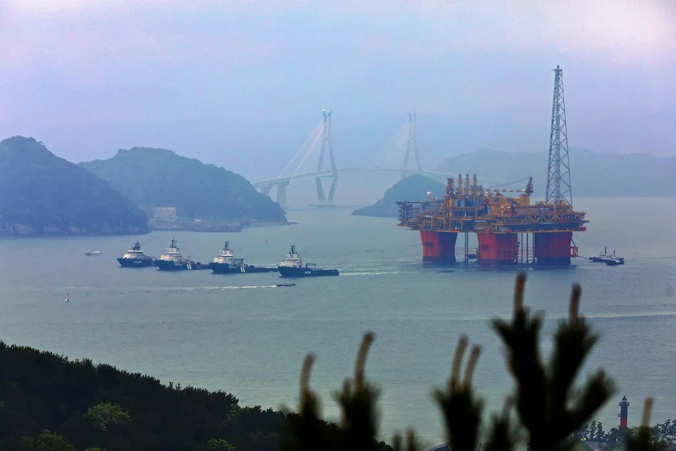 En route: the Ichthys CPF passes a bridge near Samsung Heavy Industries on its way to Australia