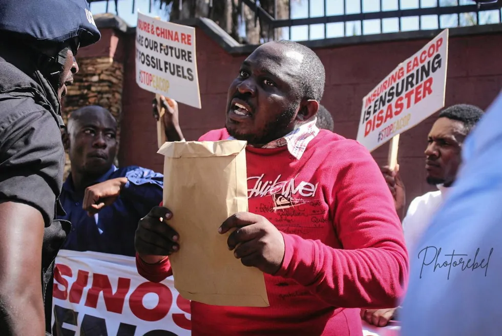 Anti-fossil fuel protestors outside the Chinese embassy in Kampala , Uganda.