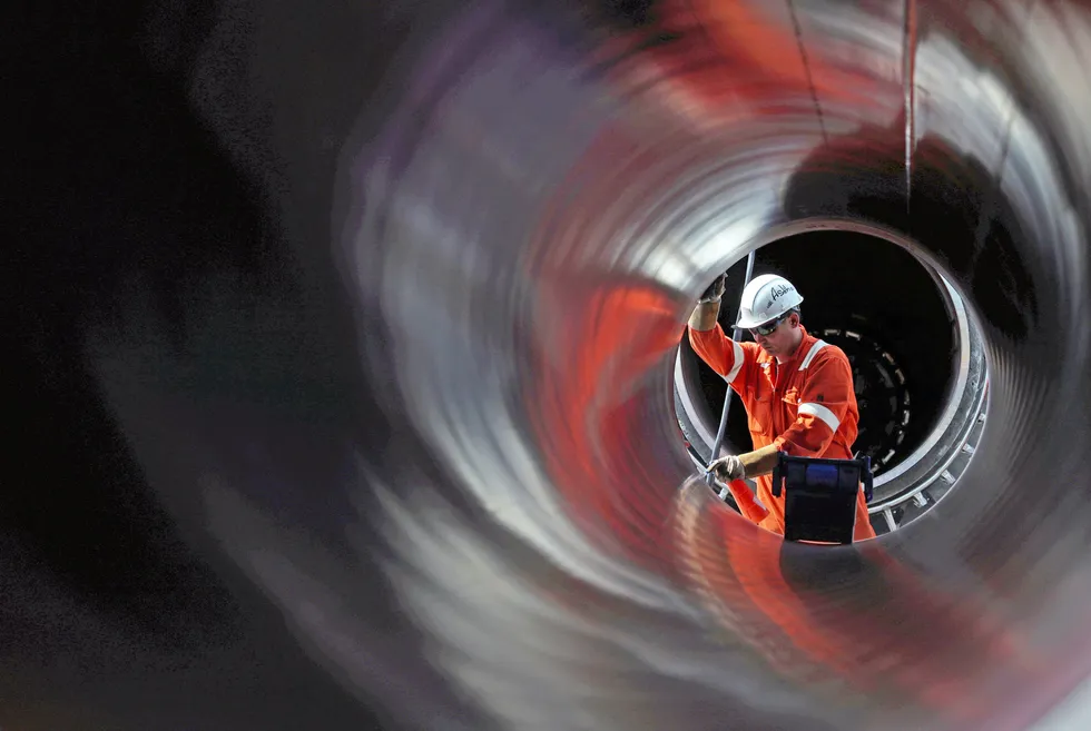 Test failed: A worker examines a pipe at a Nord Stream 2 construction site near the Russian town of Kingisepp in June 2019