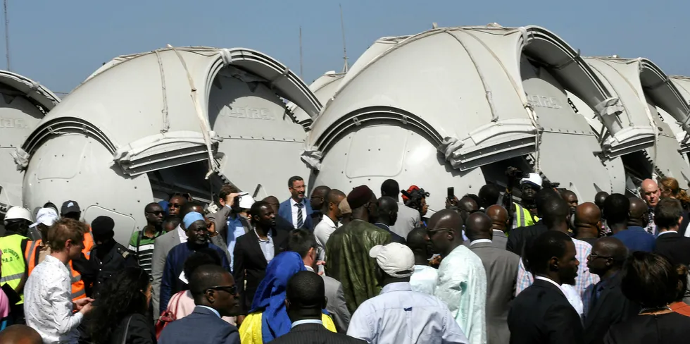 Officials gathered to mark the arrival of the components in Senegal.
