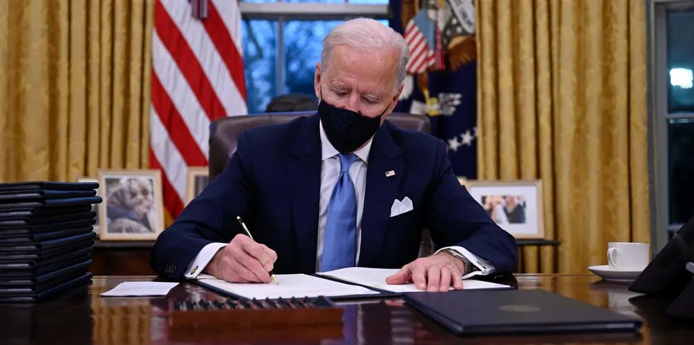 US President Joe Biden signs a series of orders at the White House in Washington, DC, after being sworn in at the US Capitol on January 20, 2021. Tackling the COVID-19 crisis is his overriding priority.
