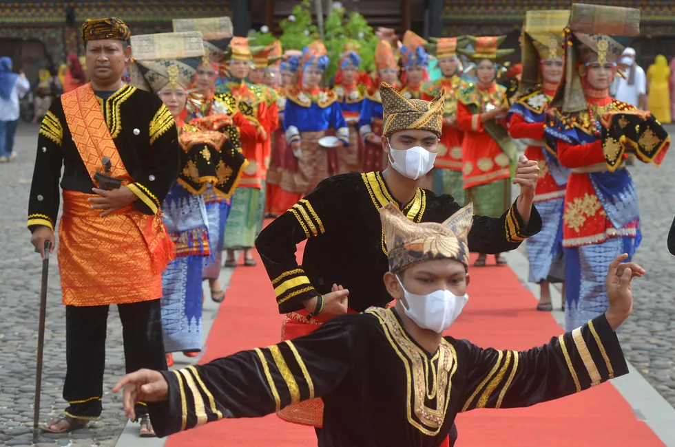 Time to celebrate: participants perform the Galombang dance during the Minangkabau festival on the Indonesian island of Sumatra