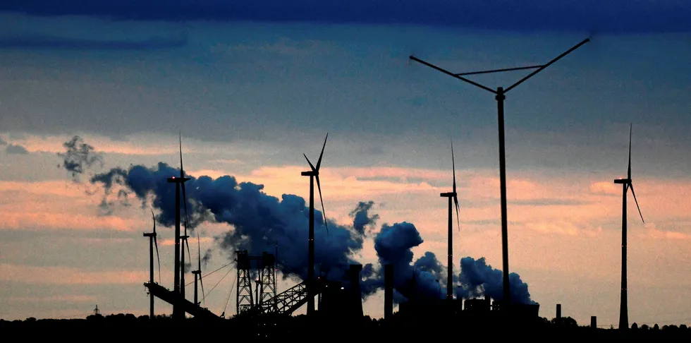 Coal-fired power plants and wind turbines of German energy giant RWE are seen at the Garzweiler lignite opencast mine in Jackerath, western Germany.
