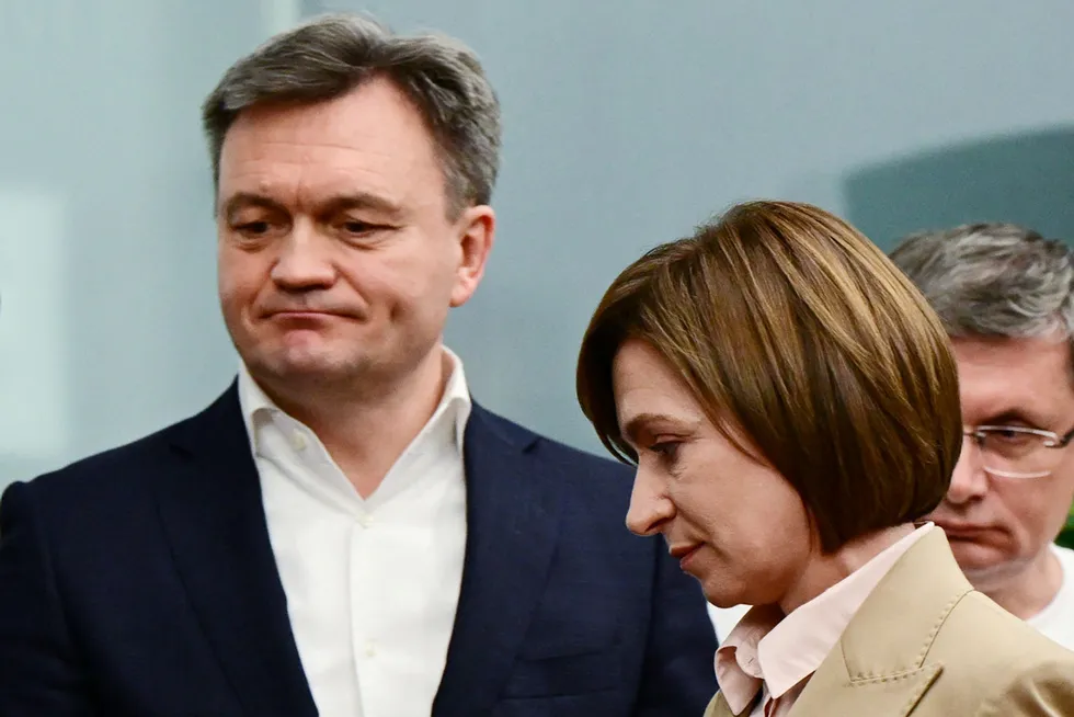 Moldova Prime Minister Dorin Recean (left) and country's President Maia Sandu.