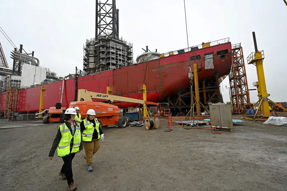 BOEM director Elizabeth Klein, front left, with other officials, tours the worksite for the nation's only wind turbine installation vessel, Charybdis.