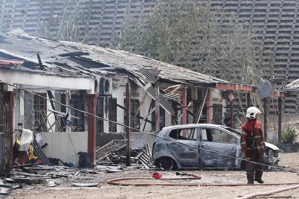 A general view shows houses that were destroyed after a gas pipeline operated by Malaysia's state energy company Petronas caught fire in Puchong, Malaysia on 1 April 2025.