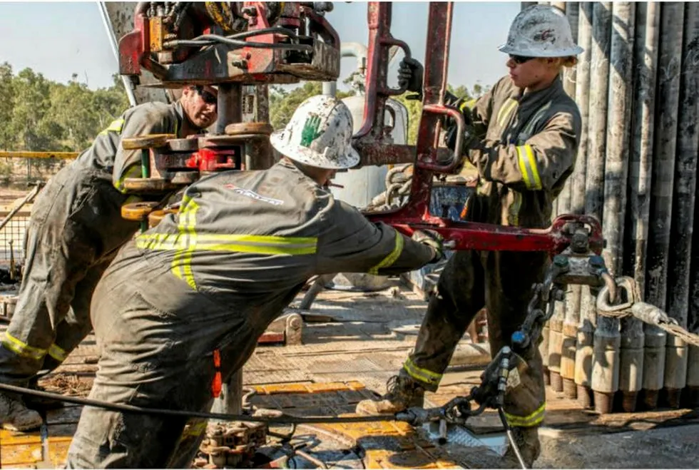 Working in the Galilee basin: roughnecks at work on Ensign Rig 932 at Albany-2