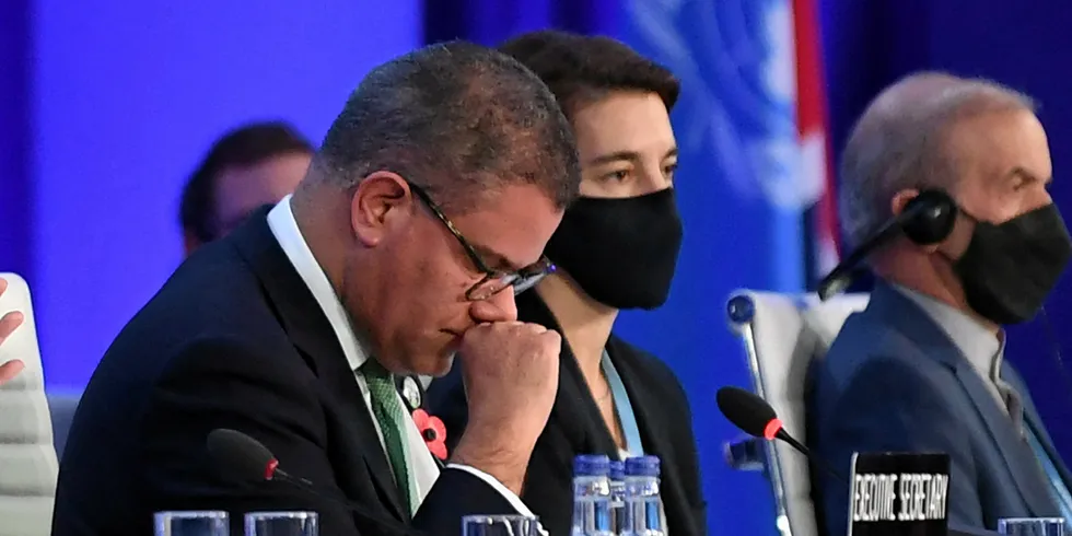Alok Sharma (L) is emotional as he makes his concluding remarks during the COP26 UN Climate Change Conference in Glasgow.