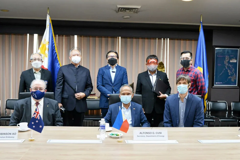 Geographical confusion: Australian Ambassador to the Philippines Steven J Robinson (left) is seated behind a New Zealand flag