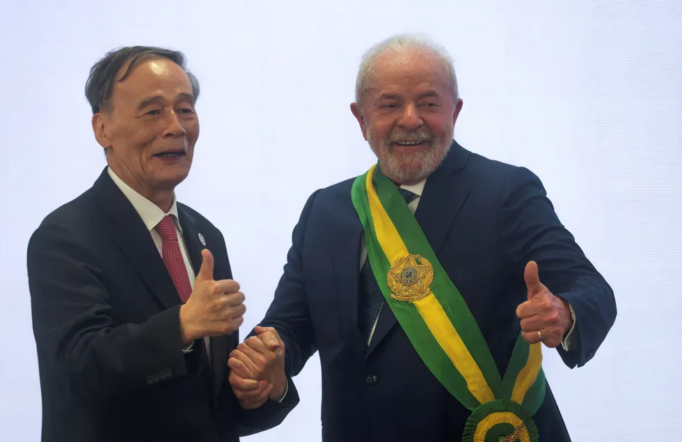 Brazil's President Luiz Inacio Lula da Silva reacts with China's Vice president Wang Qishan