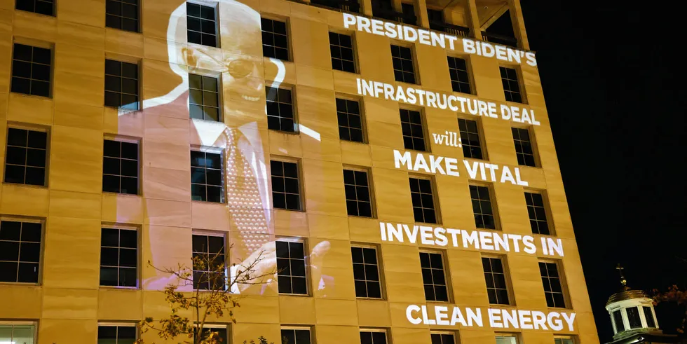 The DNC celebrates after U.S. President Joe Biden signs the infrastructure deal.