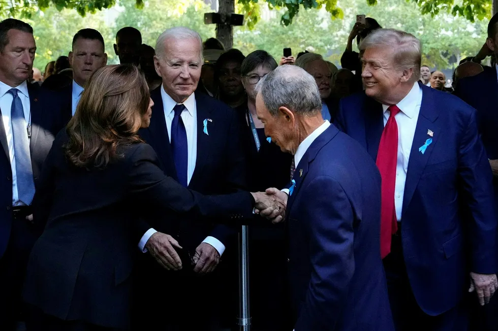 US Vice President and Democratic presidential candidate Kamala Harris (left) shakes hands with former US president and Republican presidential candidate Donald Trump (right) as former New York Mayor Michael Bloomberg (centre) and US President Joe Biden look on.