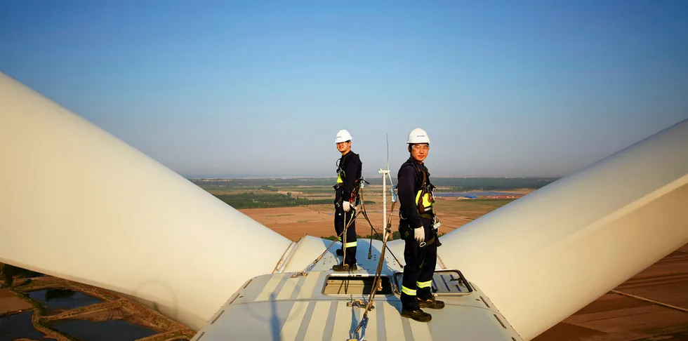 Worker on a Vestas wind turbine in China.