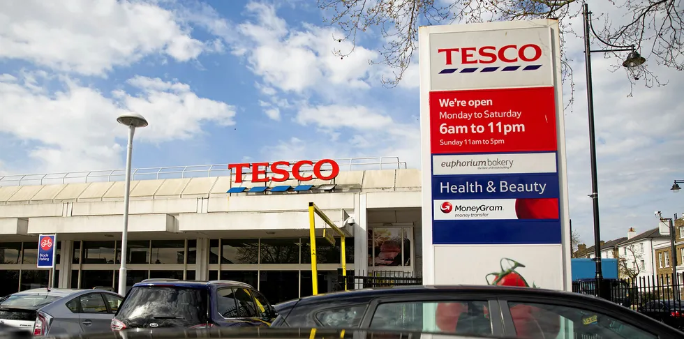 A picture shows the signage at a branch of Tesco supermarket in Brixton, south London.