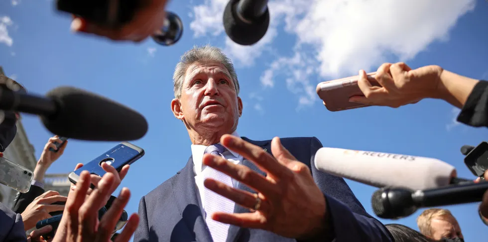 Senator Joe Manchin surrounded by reporters on Capitol Hill. The maverick senator has been blocking President Joe Biden's climate agenda for months.
