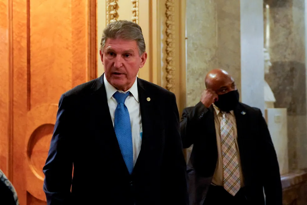Departure: US Senator Joe Manchin leaves the Senate floor after a vote at the US Capitol building in Washington D.C. on 9 December 2021