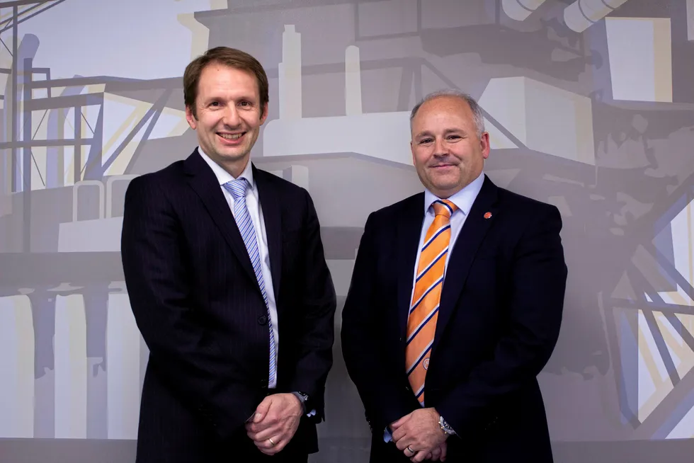 Contract signing: Bogi Vang (left), deputy country manager UK and senior financial adviser at DNO North Sea, with Phil Milton (right), chief executive of Well-Safe Solutions