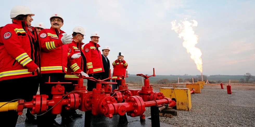 Celebratory scenes at a flare lighting ceremony at a new natural-gas well in Turkey. Energy minister Fatih Donmez is pictured, second left.