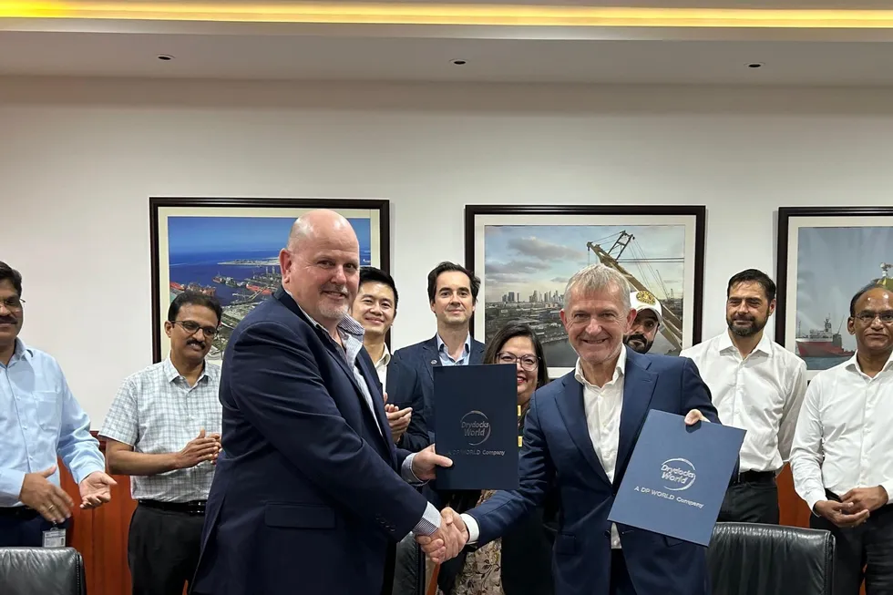 Modec and Drydocks World executives signing a deal for life extension work on the Baobab Ivoirien FPSO.