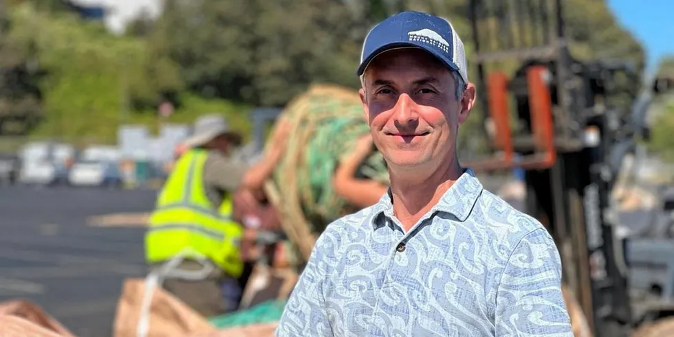American Seafoods Chief Sustainability Officer Tim Fitzgerald dismantles an old pollock net at Pier 91 on Sept. 6, 2022. The company has created a new partnership to repurpose its plastic waste.
