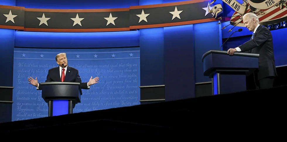 Democratic Presidential candidate and former US Vice President Joe Biden (R) looks on as US President Donald Trump speaks during the final presidential debate at Belmont University in Nashville, Tennessee, on October 22, 2020.