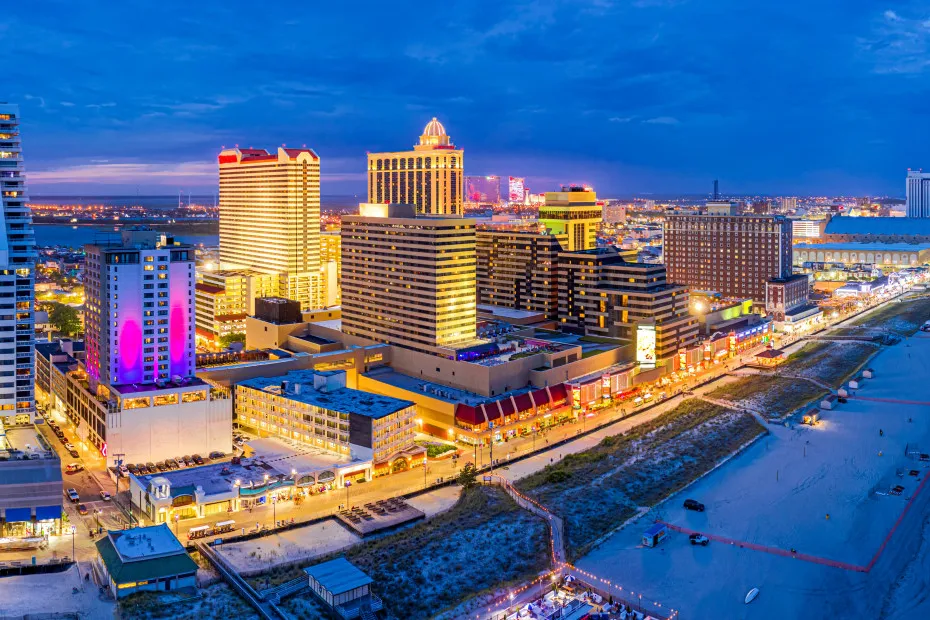 Aerial panorama of Atlantic City, New Jersey along the boardwalk at dusk.