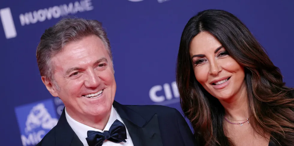Flavio Cattaneo, pictured with his wife the theatre star Sabrina Ferilli, has been selected to lead Enel.