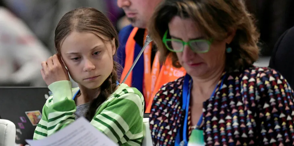 Swedish climate activist Greta Thunberg and Spanish minister of energy and climate change Teresa Ribera together during the UN Climate Change Conference COP25 in Madrid, on December 11, 2019.