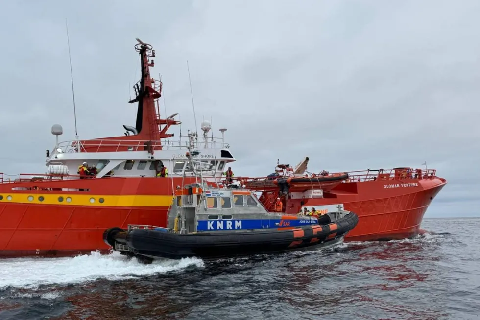 A Royal Netherlands Sea Rescue Institution (KNRM) vessel attends to the Glomar Venture after the collision on Sunday.