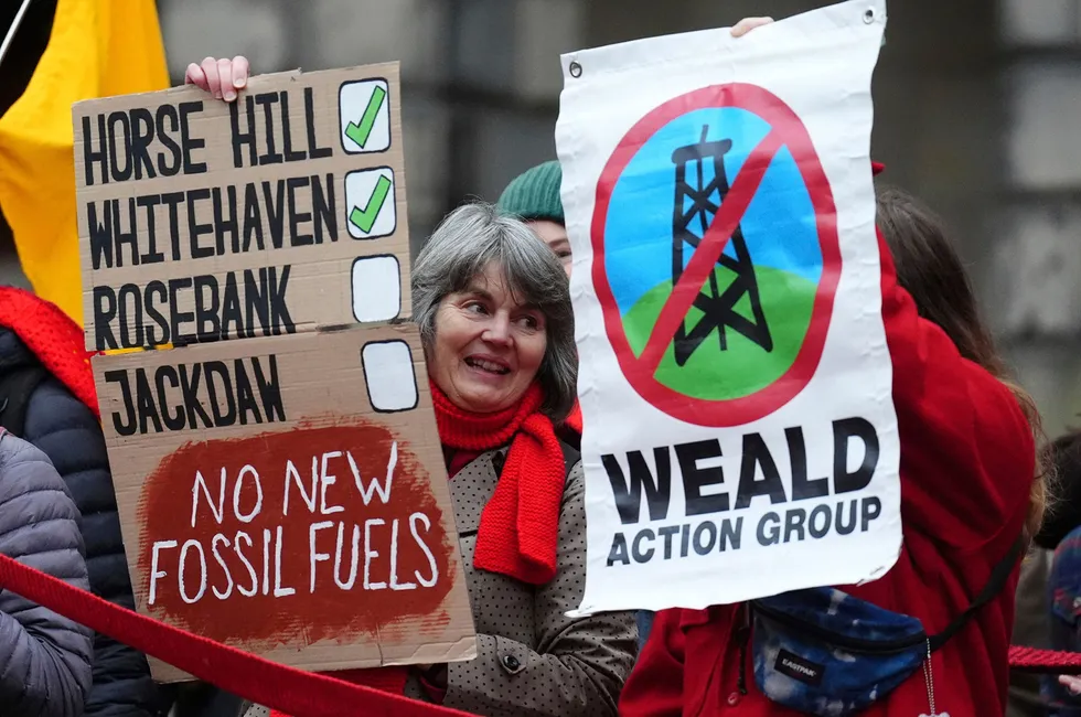 Climate activists from Greenpeace and Uplift gather during a demonstration outside the Scottish Court of Session on the first day of the Rosebank and Jackdaw judicial review hearing, in Edinburgh, UK, on 12 November 2024.