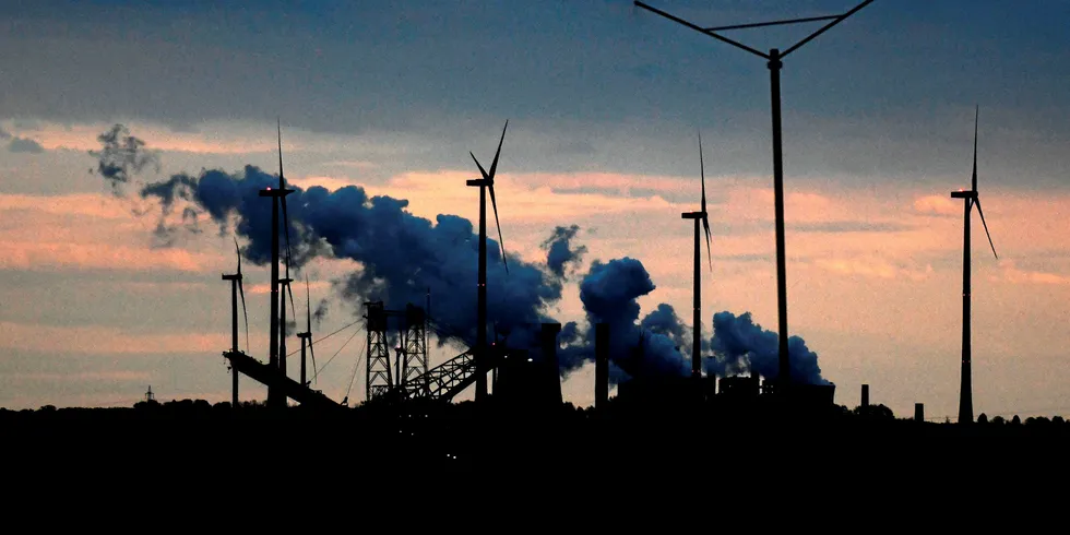 Coal-fired power plants and wind turbines of German energy giant RWE are seen at the Garzweiler lignite opencast mine