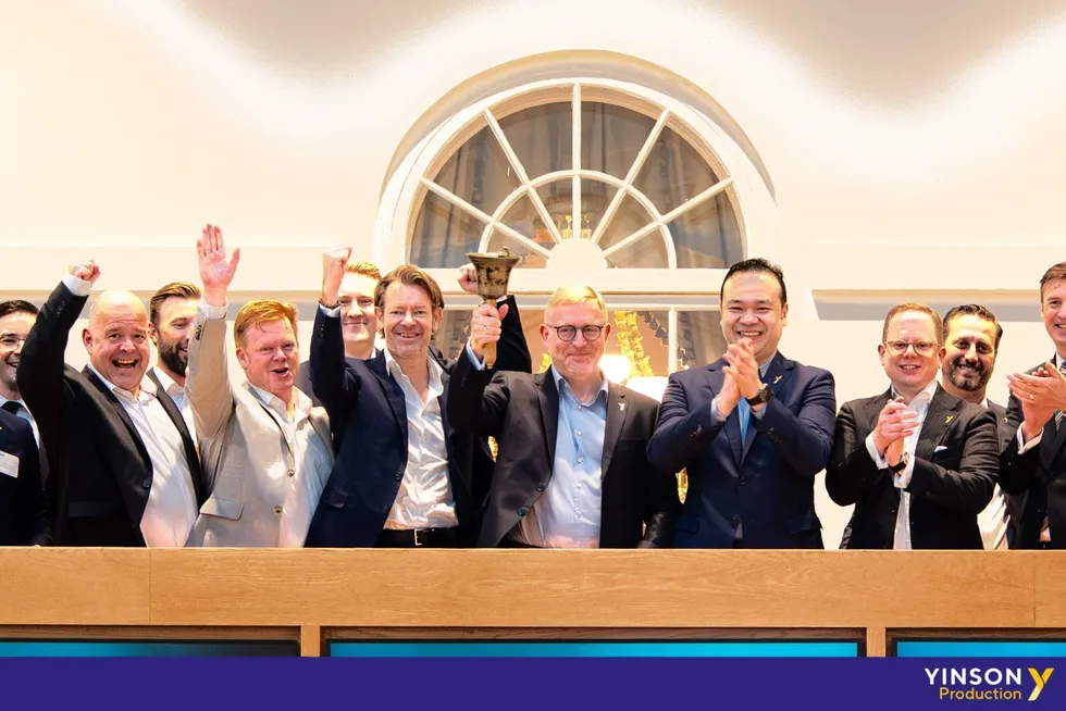 Yinson Production's chief executive and Yinson Holdings' chief executive ring the bell in Oslo