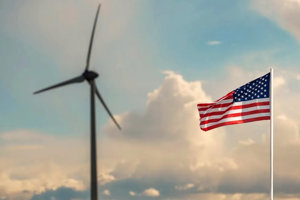 The US flag and a wind turbine.