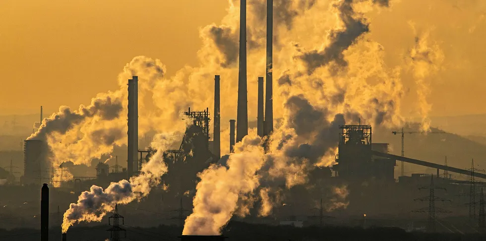 Steam and exhaust rise from the chemical company Oxea (front) and the coking plant KBS Kokereibetriebsgesellschaft Schwelgern GmbH (behind) on a cold winter day.