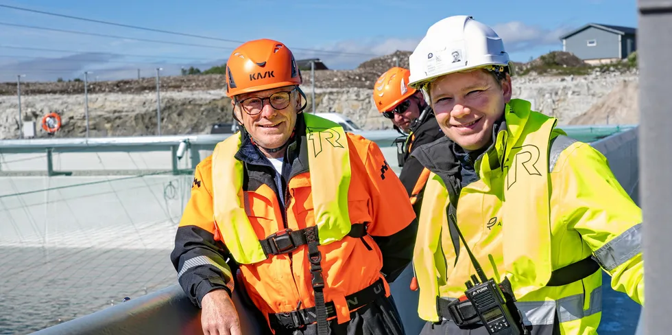 Andfjord Salmon Chairman Roger Mosand (left) and CEO Martin Rasmussen watched on as 200,000 smolt were released into the company's ponds.