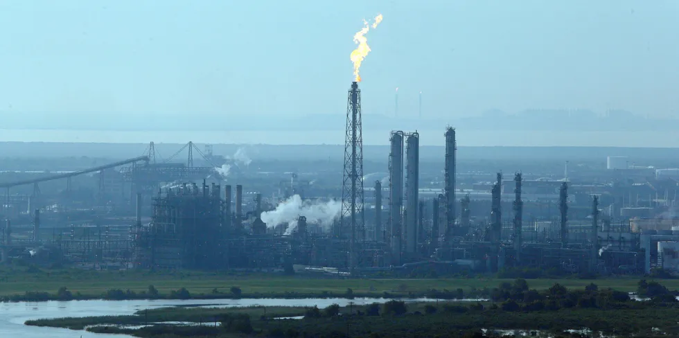 A flare stack puts out a flame at a refinery in Port Arthur, Texas