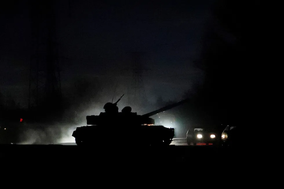 On the streets: a tank drives along a street in the separatist-controlled city of Donetsk in the east of Ukraine after Russian President Vladimir Putin ordered the deployment of Russian troops there and in the other self-proclaimed republic of Luhansk