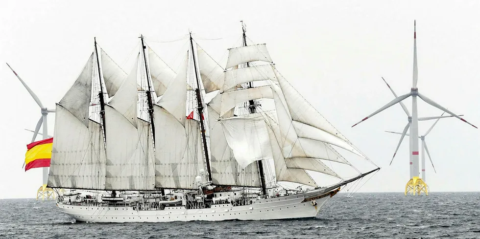 Sail ship in front of Wikinger - one of Germany's latest offshore wind farms