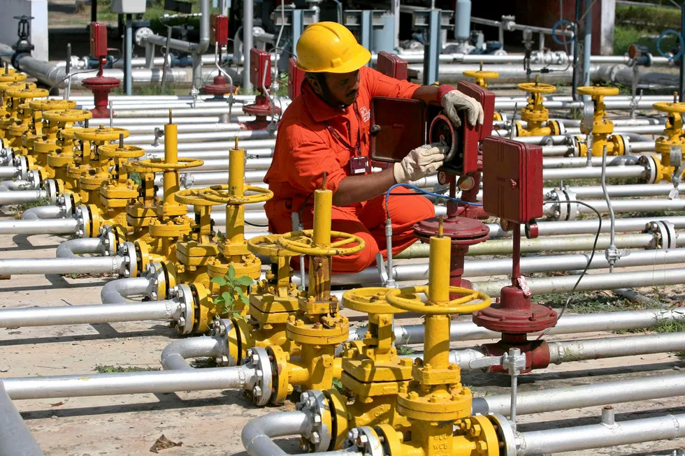 At work: an engineer of Oil and Natural Gas Corporation at the Kalol oilfield in India's western state of Gujarat