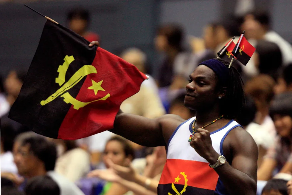 Flying the flag: an Angolan basketball was his country's flag after his team scored against Spain