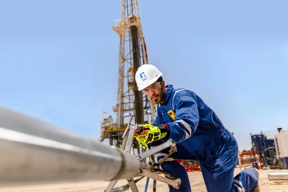 An Adnoc worker at at wireline truck in Abu Dhabi.