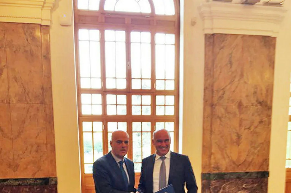 Handshake: Eni chief executive Claudio Descalzi (left) and Politecnico di Milano university rector Ferrucio Resta sign the scientific research alliance