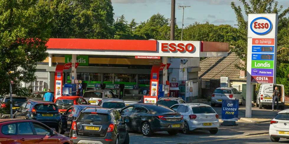Bournemouth, UK: Dozens of vehicles queue up for fuel at an ESSO filling station as the lack of lorry drivers continues to create gaps across the country .