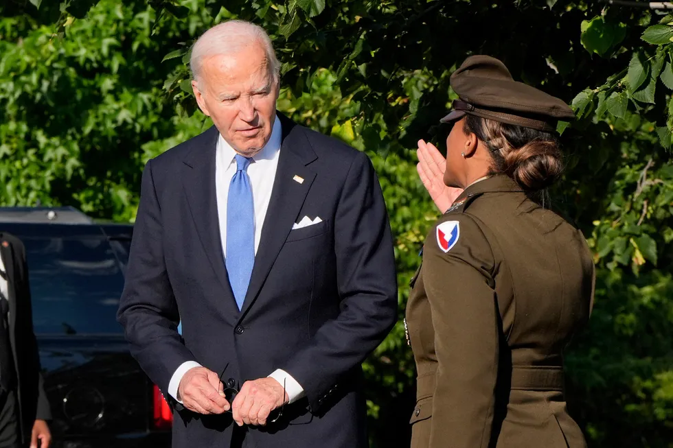 US President Joe Biden (left), is greeted as he arrives in Washington DC on return from Camp David on 1 July 2024.