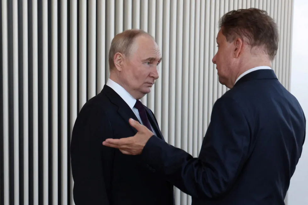Russia’s President Vladimir Putin (left) speaks with Gazprom executive chairman Alexei Miller.