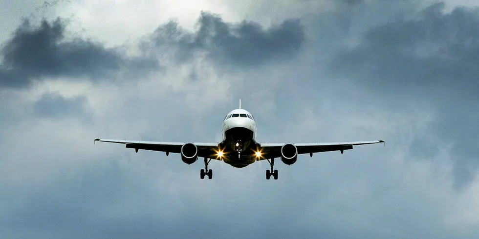 A dual-engine plane coming in to land at London's Heathrow Airport.