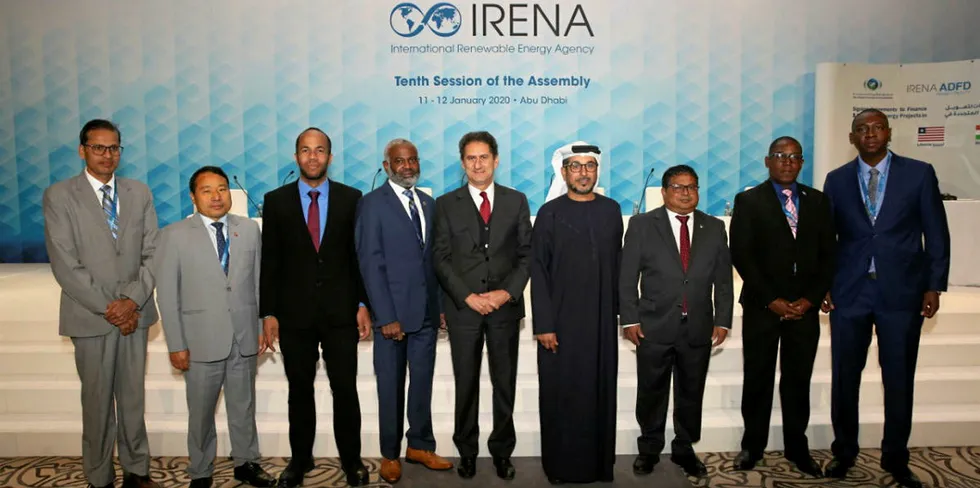 Irena director-general Francesco La Camera (centre) with represenatives of the eight recipient countries.