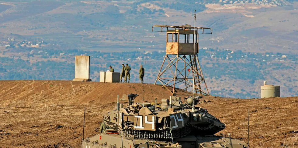 Israeli soldiers and armoured vehicles are pictured on November 19, 2019 near the border with Syria in the annexed Golan Heights.